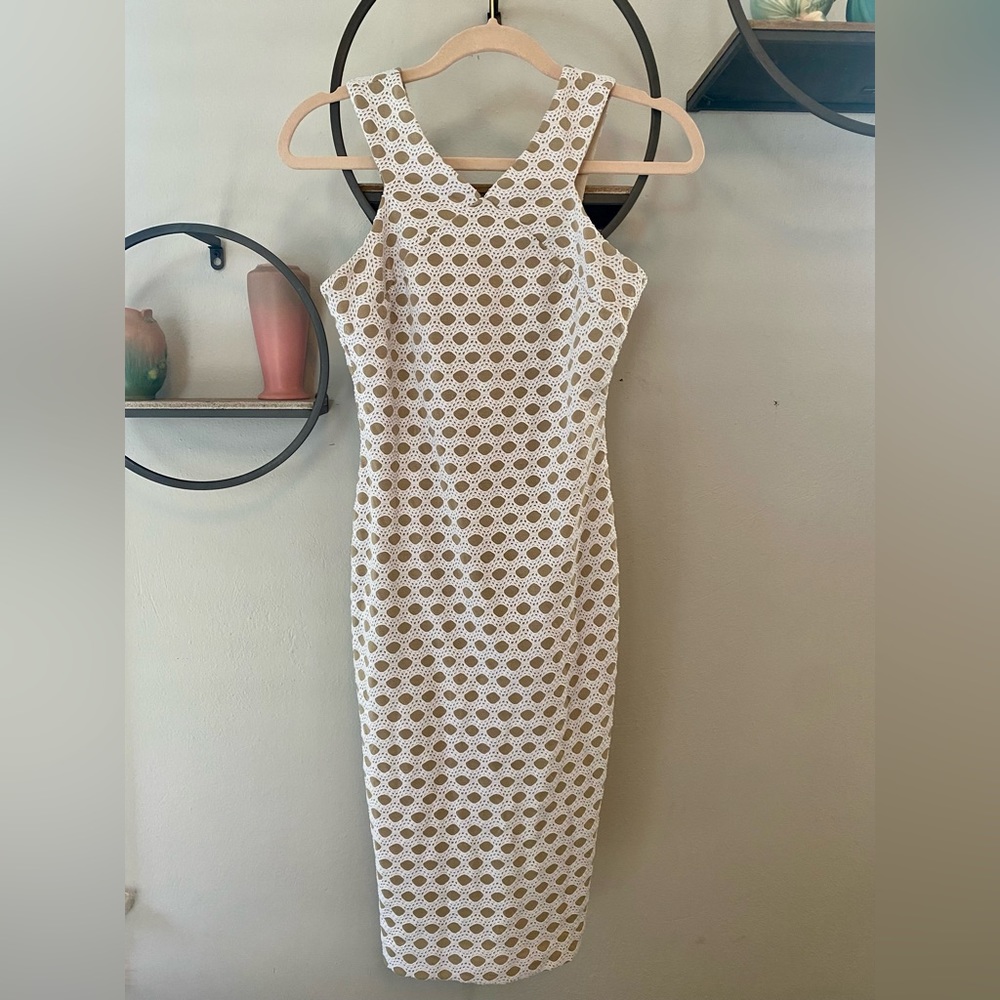 Taylor slim cut dress that hits right below the knee halter style.